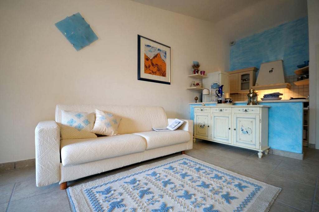 Art-7 Tappeto in lana panna con disegno pavoncella celeste